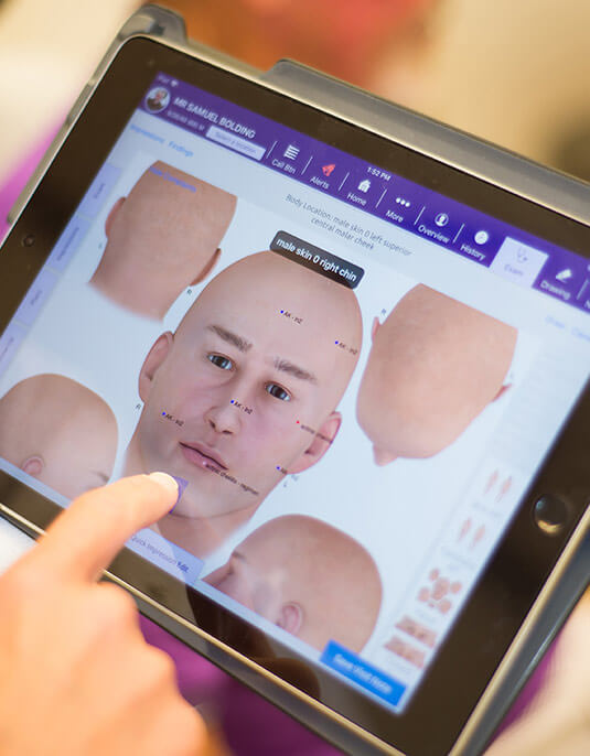 Tablet analyzing facial model